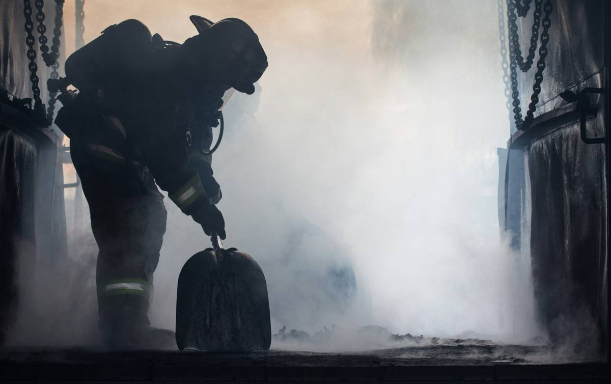 First responder reviewing travel hero protection insurance documents before international deployment